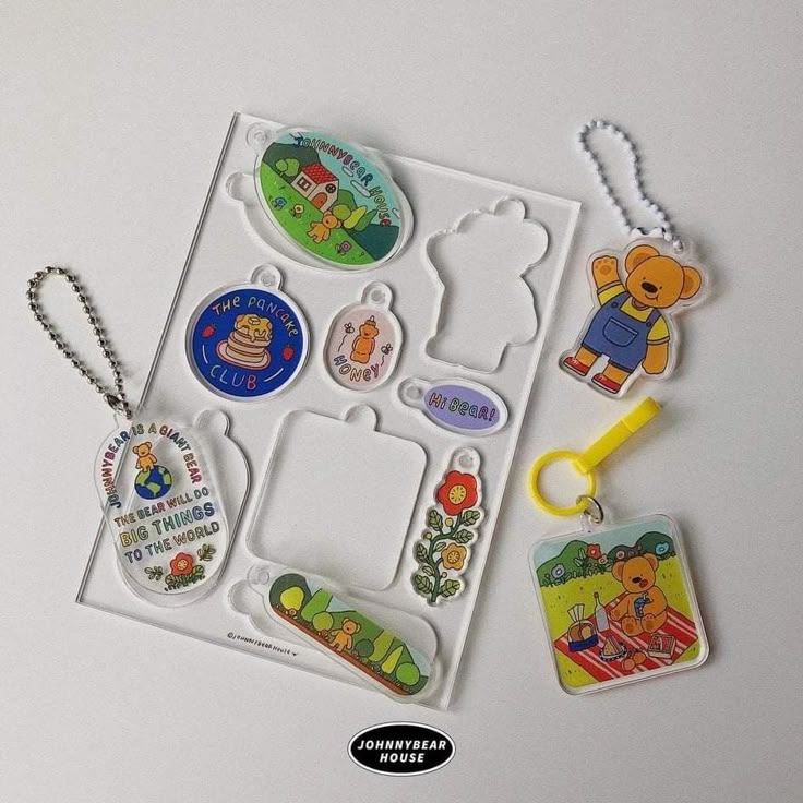 various key chains and tags on a white surface