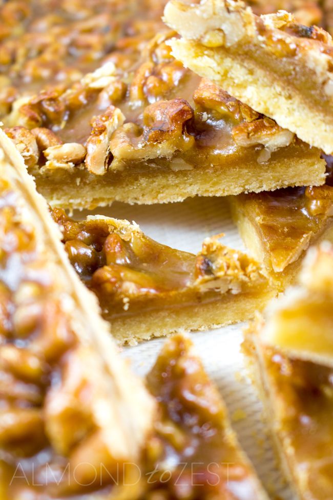 several pieces of pecan pie are stacked on top of each other