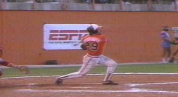 a baseball player swinging a bat on top of a field