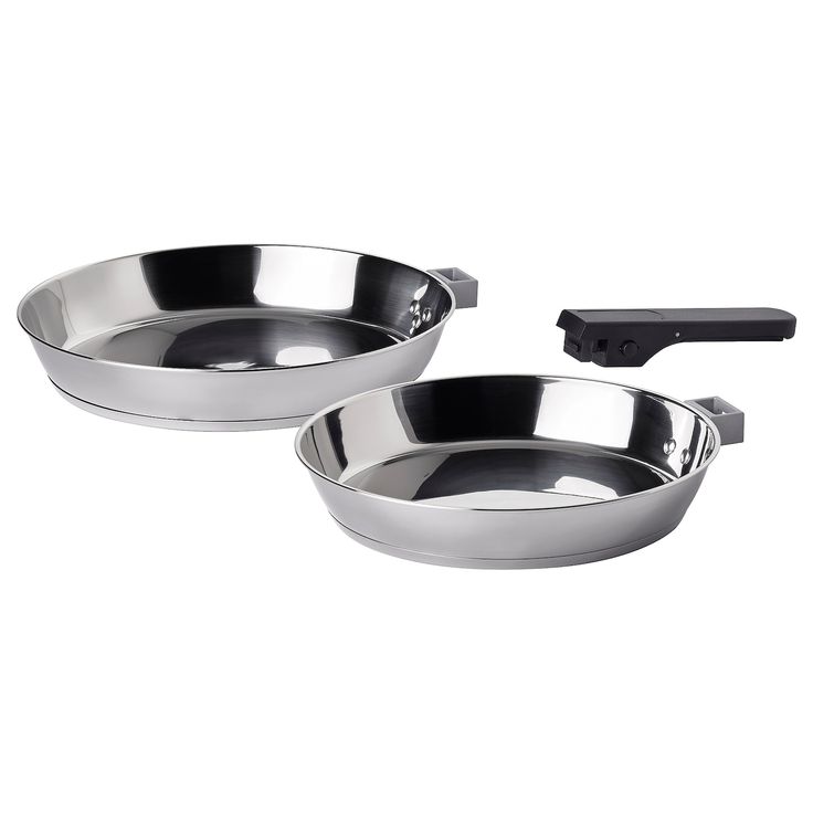 two stainless steel pans sitting side by side