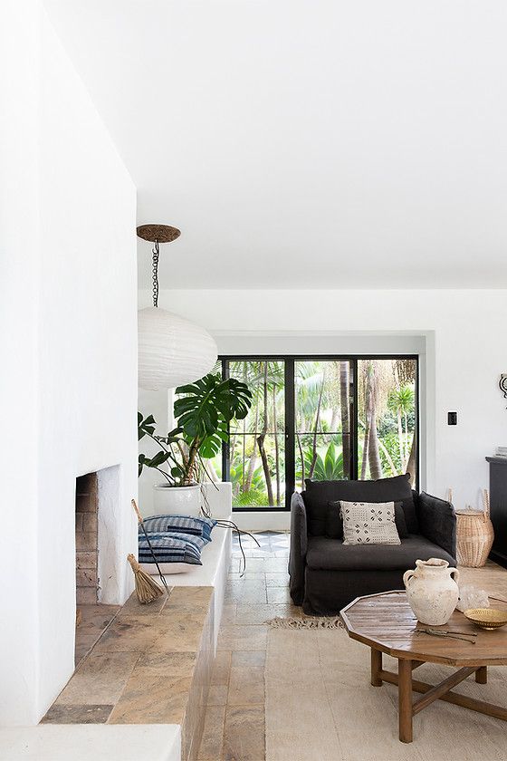 a living room filled with furniture and a fire place