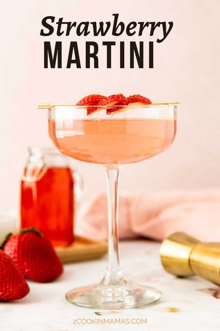 strawberry martini in a coupe glass with strawberries on the rim and text overlay