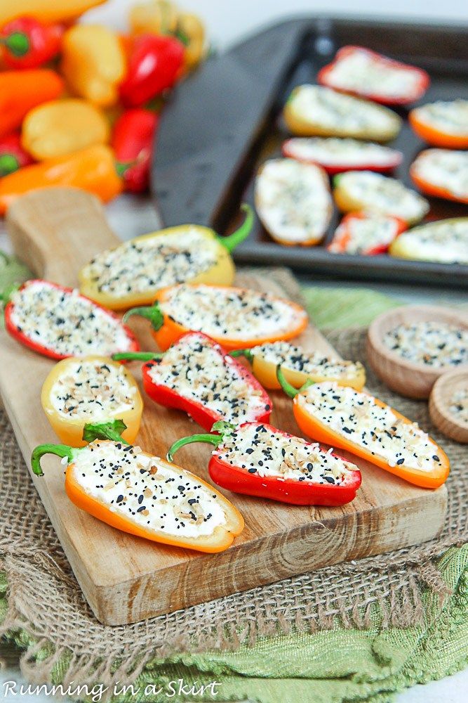 sliced bell peppers on a cutting board with other vegetables in the background