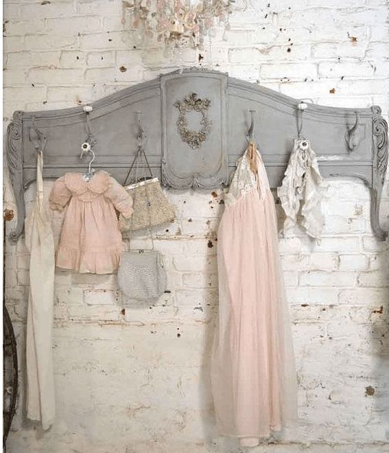 an old bed with clothes hanging on it's headboard and the caption reads, turn a vintage foot board into a stunning coat rack