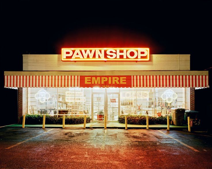 an empty pawn shop at night with the lights on