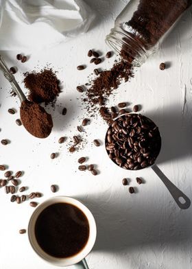 there are coffee grounds and spoons on the table