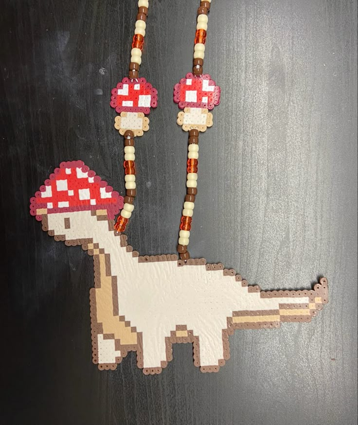 a piece of art made to look like a dinosaur with mushrooms on it's back