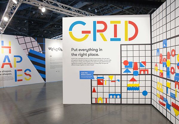 an exhibit with colorful graphics on the walls