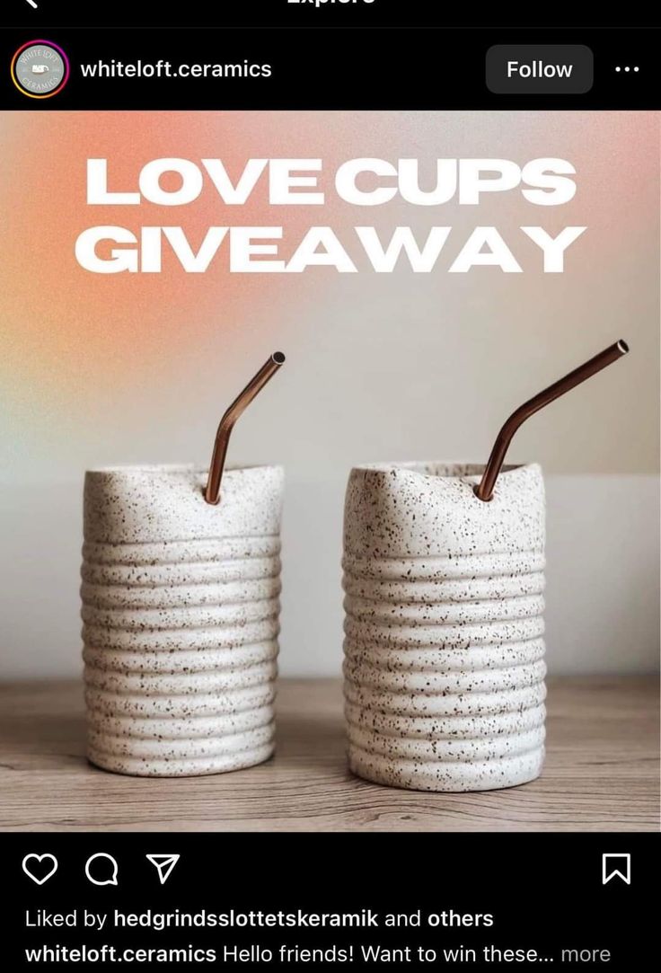 two cups with straws in them sitting next to each other