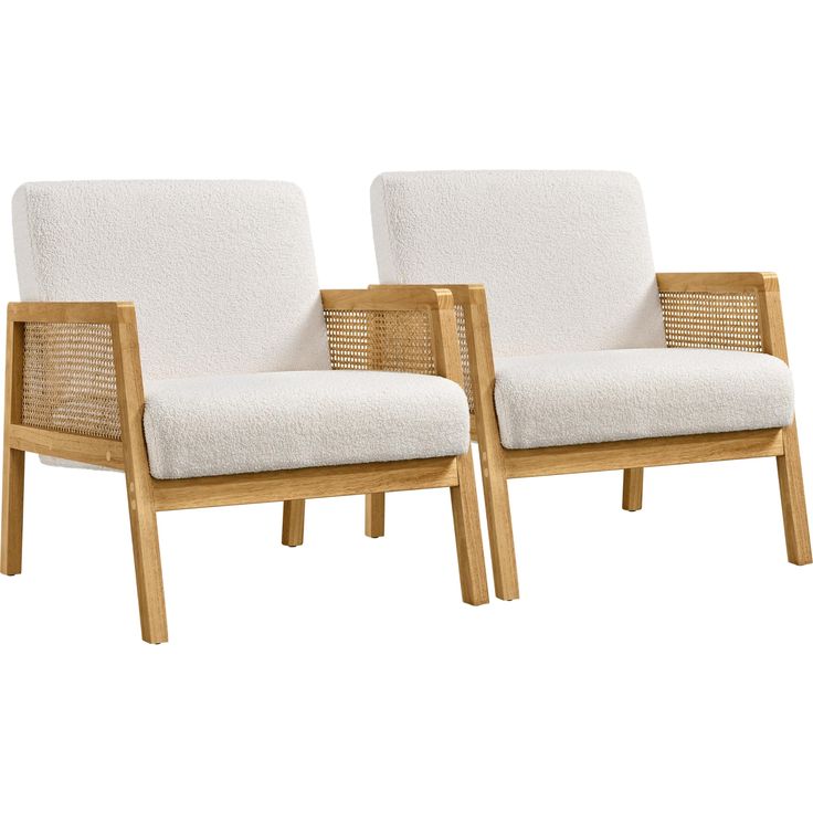 two chairs sitting next to each other on a white background