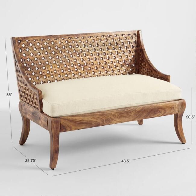 a wooden bench with a white cushion on it's back and armrests