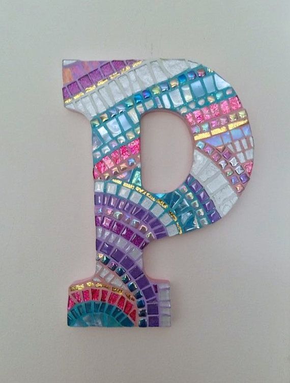 the letter p is made out of mosaic tiles and has a colorful design on it