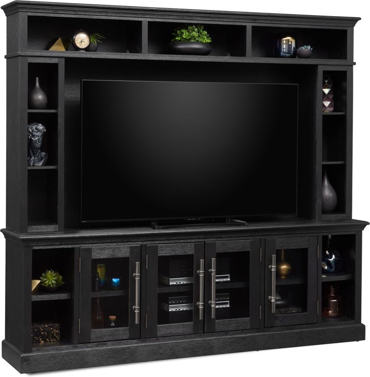 a black entertainment center with shelves and a flat screen tv