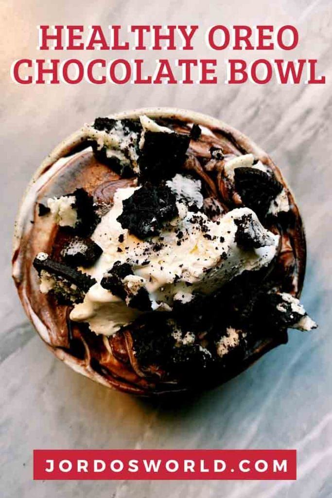 a bowl filled with chocolate and cream on top of a table