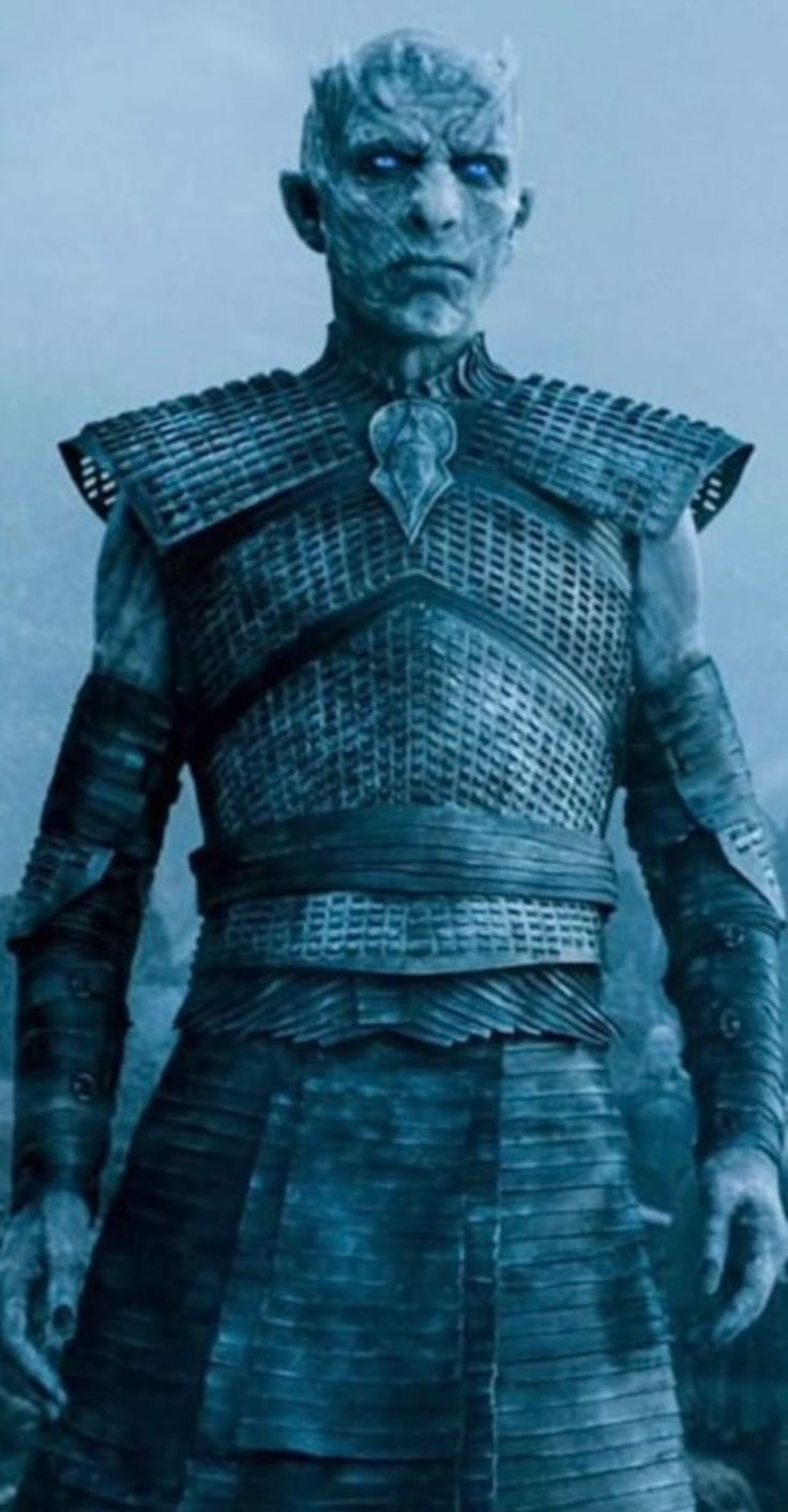 the white walker from game of thrones is standing in front of a mountain range