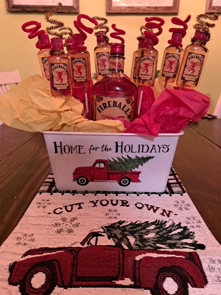 a table topped with bottles of liquor and christmas decorations