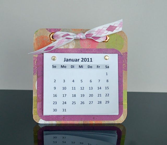 a calendar with a ribbon tied around it