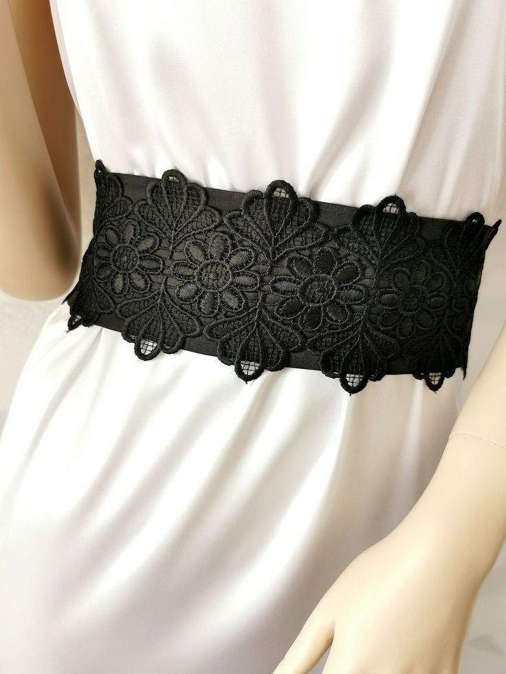 If you would like this belt in a different length or width, please, write to us. The Black wide satin belt with lace. This extra long sash is 3 inches wide and 100 inches long. The length of the lace on the belt is 20 inches. Belt material: stretch satin, lace. The satin belt is available in the following colors: 1 White 2 Ivory 3 Champagne 4 Beige 5 Peach 6 Light pink 7 Pink 8 Lilac 9 Dark pink 10 Red 11 Burgundy 12 Terracotta 13 Gray 14 Dark brown 15 Black  16 Dark green 17 Sky blue 18 Royal blue 19 Navy blue  20 Aqua blue Elegant Lace Wedding Corset Belt, Elegant Wedding Lace Corset Belt, Elegant Lace Corset Belt, Lace Corset Belt For Wedding, Lace Wedding Corset Belt, Wedding Black Fitted Corset Belt, Elegant Fitted Corset Belt With Lace Trim, Elegant Black Belt For Evening, Elegant Black Corset Belt For Weddings