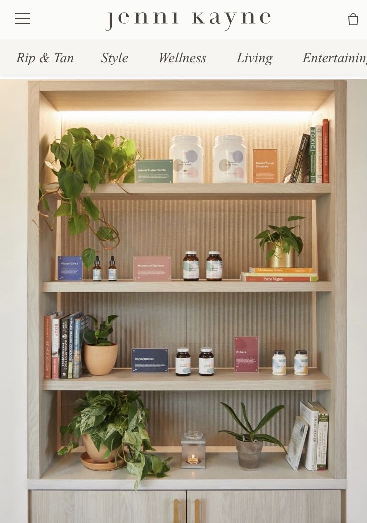 the shelves are filled with plants and books