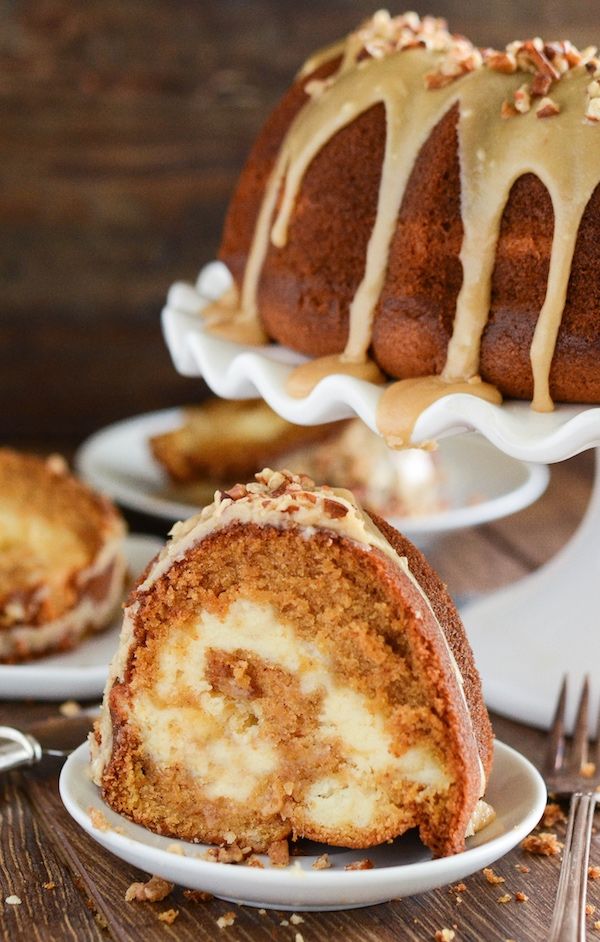 a bundt cake is cut in half and sitting on a plate with another bundt cake next to it