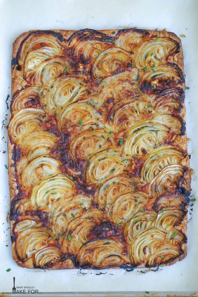 a square casserole dish with meat and vegetables