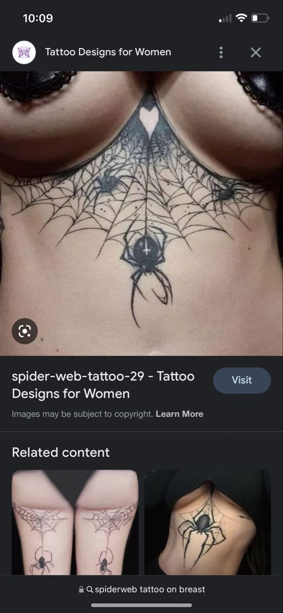 an image of the back of a woman's stomach with tattoos on it and spider web