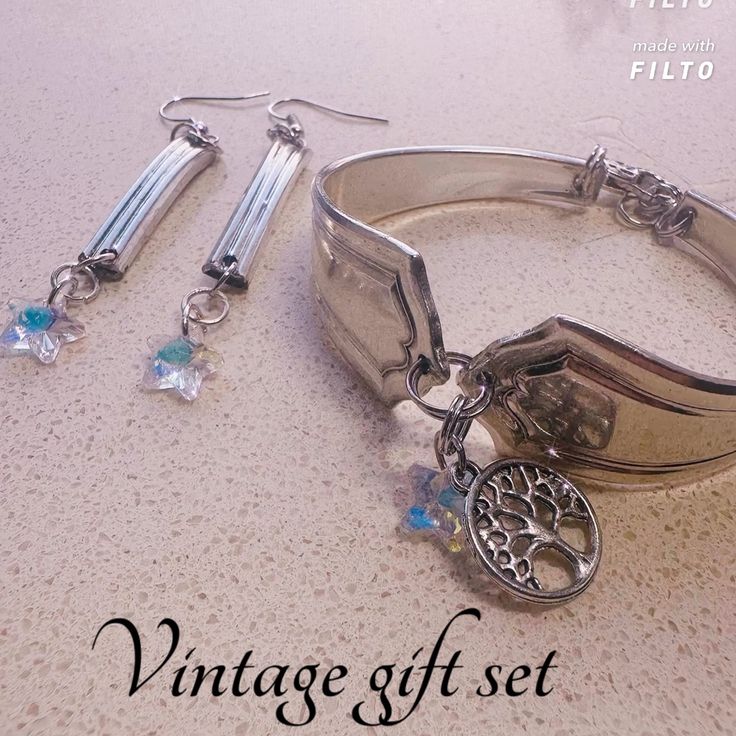 a set of silver bracelets and earrings on a table with the words vintage gift set written below it