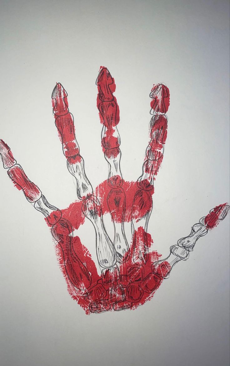 a drawing of a hand is shown with red paint on the palm and hands are drawn in white paper