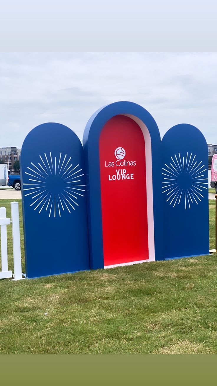 three blue and red arches with the words love your life lounge in front of them