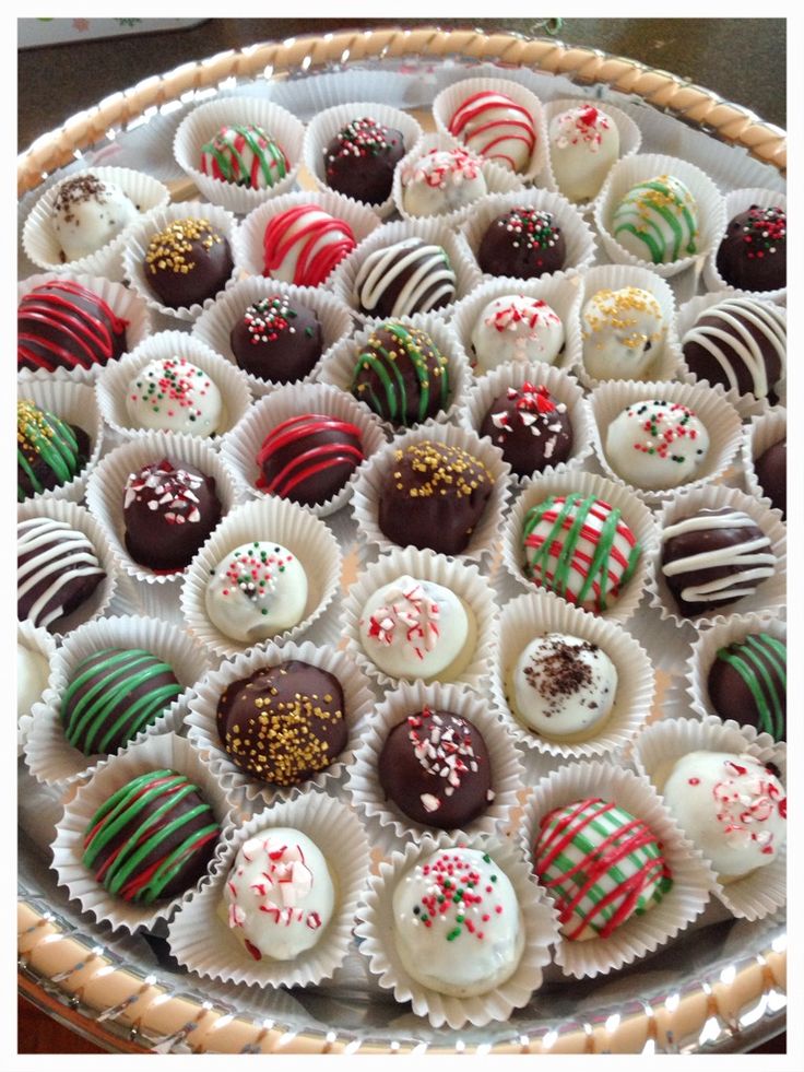 a basket filled with lots of different types of chocolates on top of a table