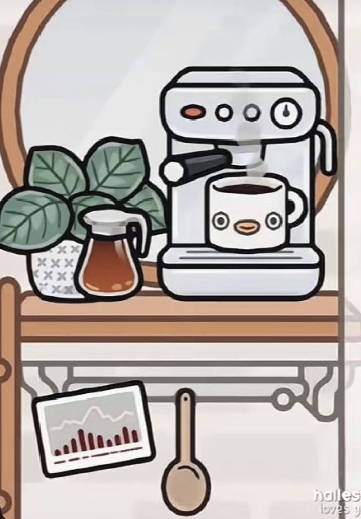 a coffee maker sitting on top of a wooden table next to a potted plant