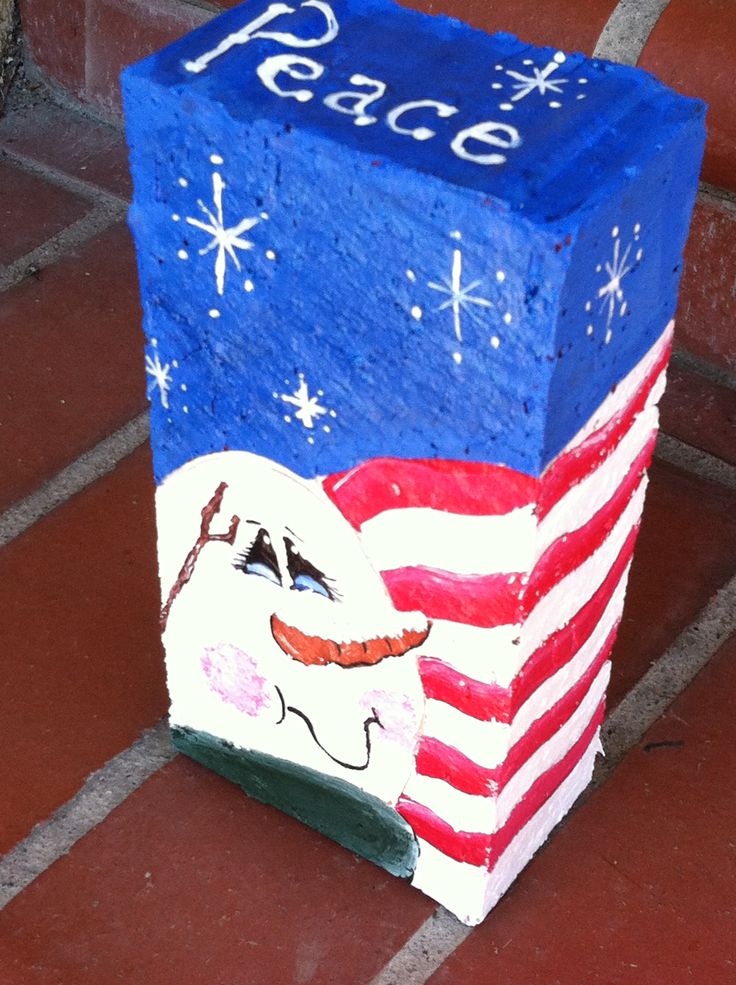 a painted box sitting on top of a red, white and blue floor