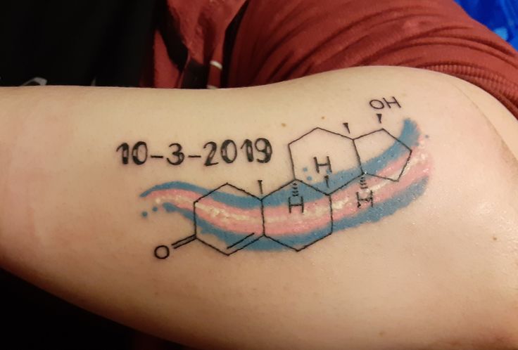 a person with a tattoo on their arm that reads 10 - 3 - 2019 and has the chemical symbol for hydrogen