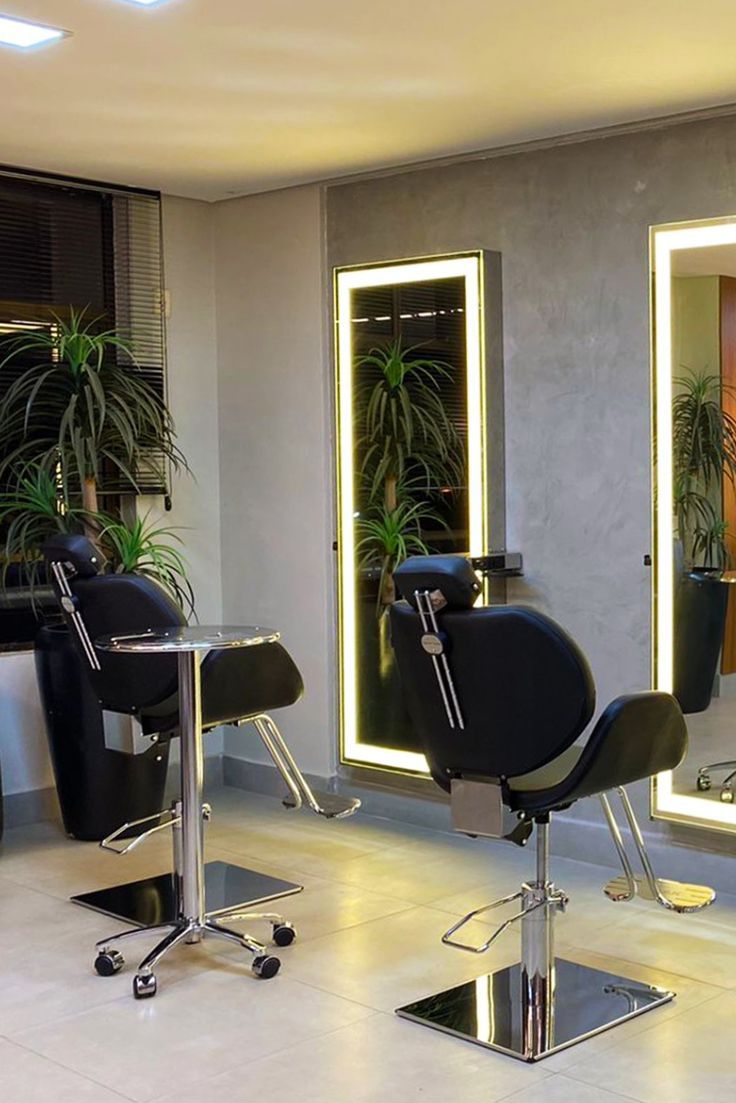 a hair salon with chairs and mirrors in it