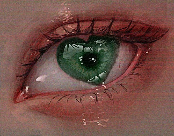 an eye with green and red paint on it