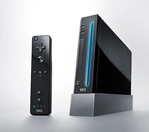 an image of a video game system with remote control in front of it and on the other side