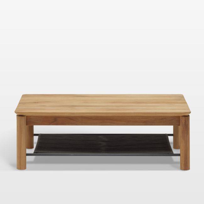 a wooden coffee table sitting on top of a metal shelf