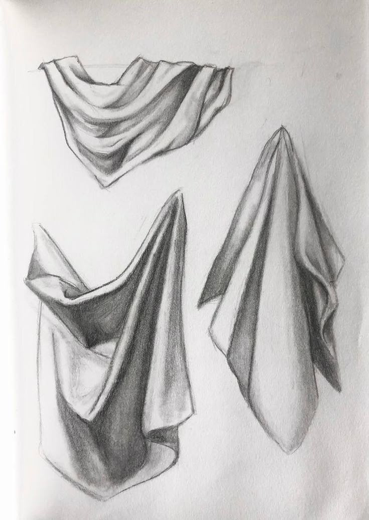 two drawings of folded fabric on white paper