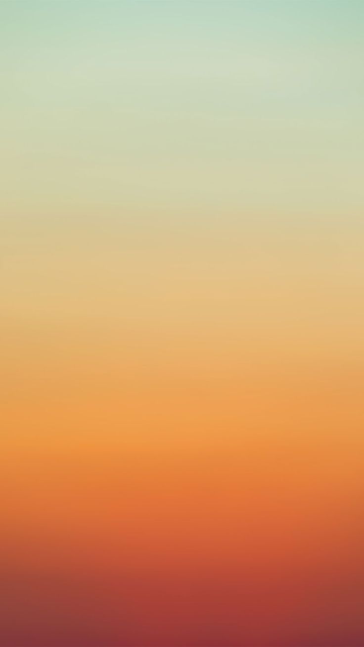 an airplane flying in the sky at sunset or sunrise with orange and blue colors behind it