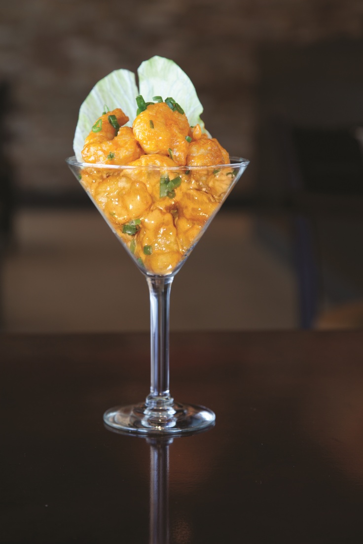 a glass filled with food sitting on top of a table