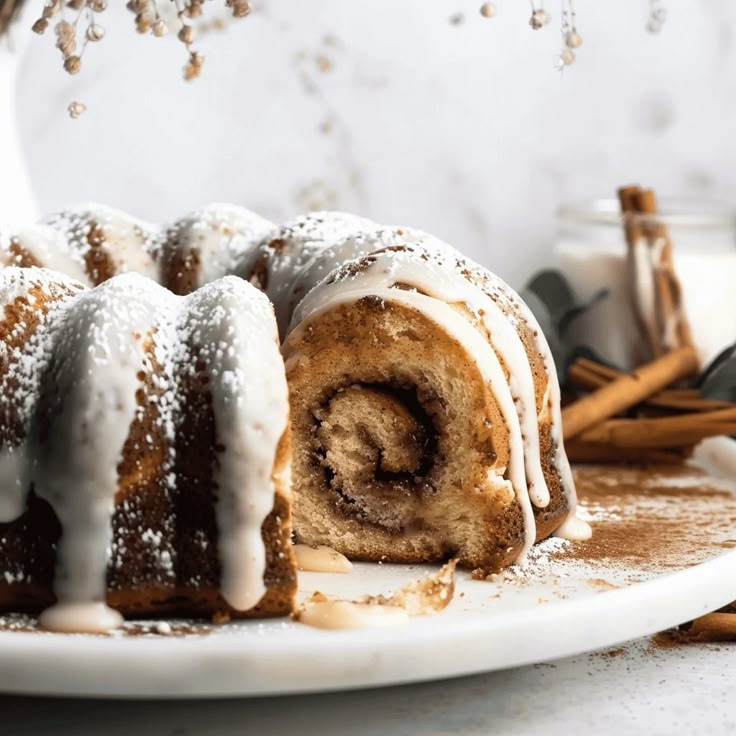 cinnamon bundt cake with icing on a white plate