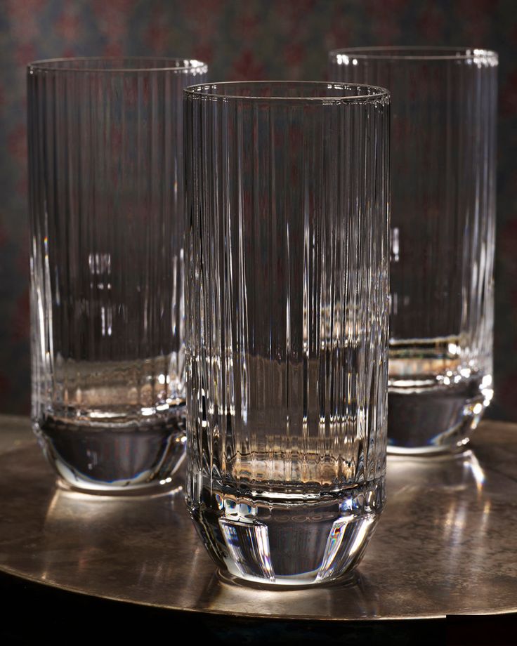 three glasses sitting on top of a table