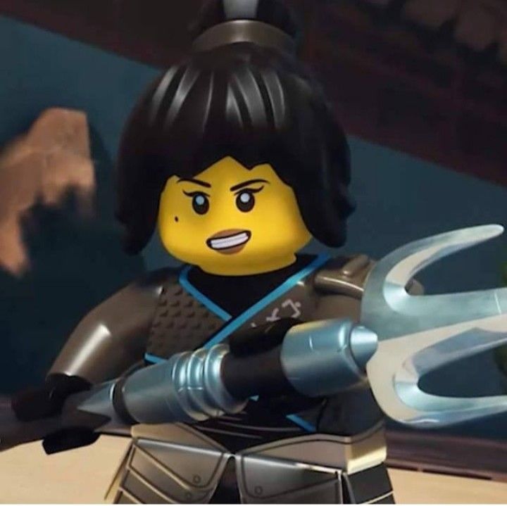 the lego movie character is holding a giant pair of scissors