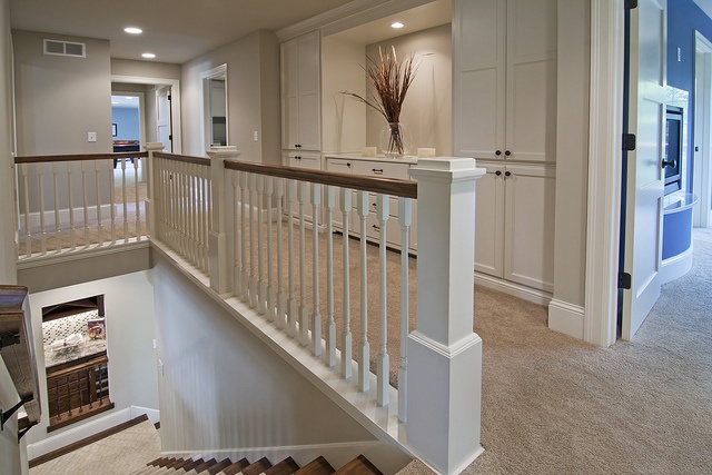 a large open floor plan with white railings