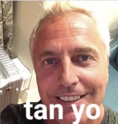 an older man with blonde hair smiling at the camera and text that reads tan yo