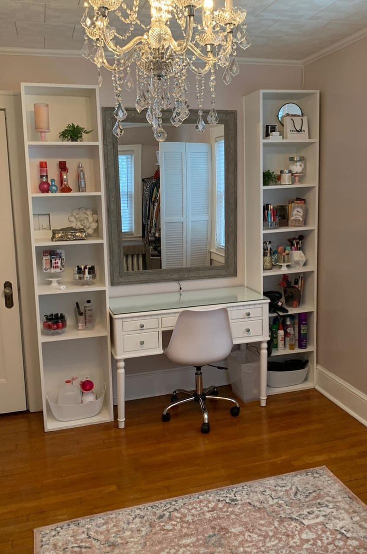 a white desk with a mirror and some shelves