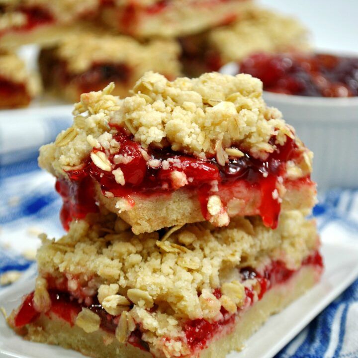 strawberry crumbler bars stacked on top of each other