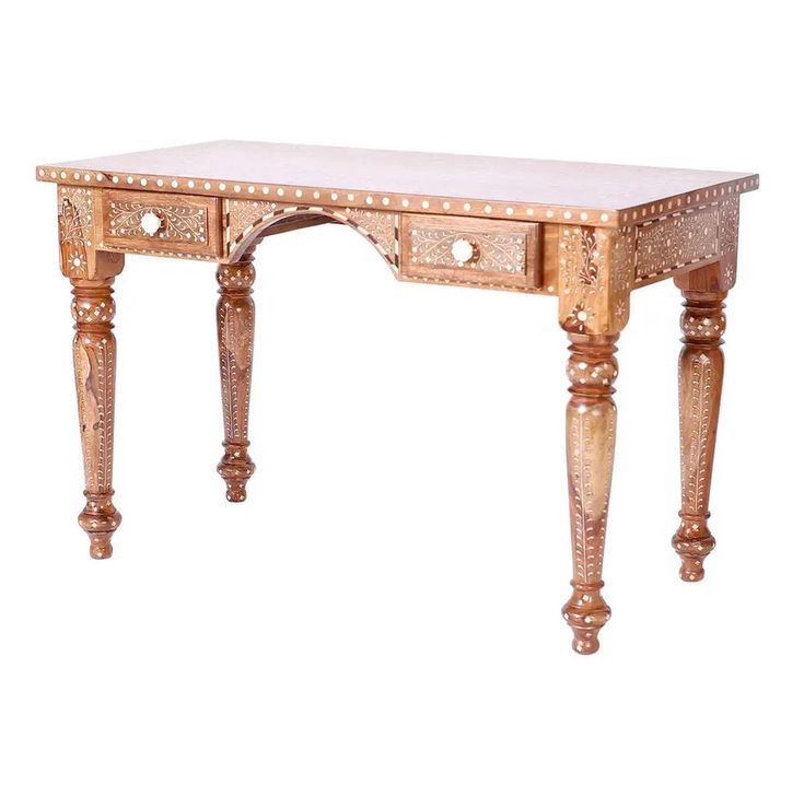 an ornate wooden desk with white marble top and legs, on display against a white background