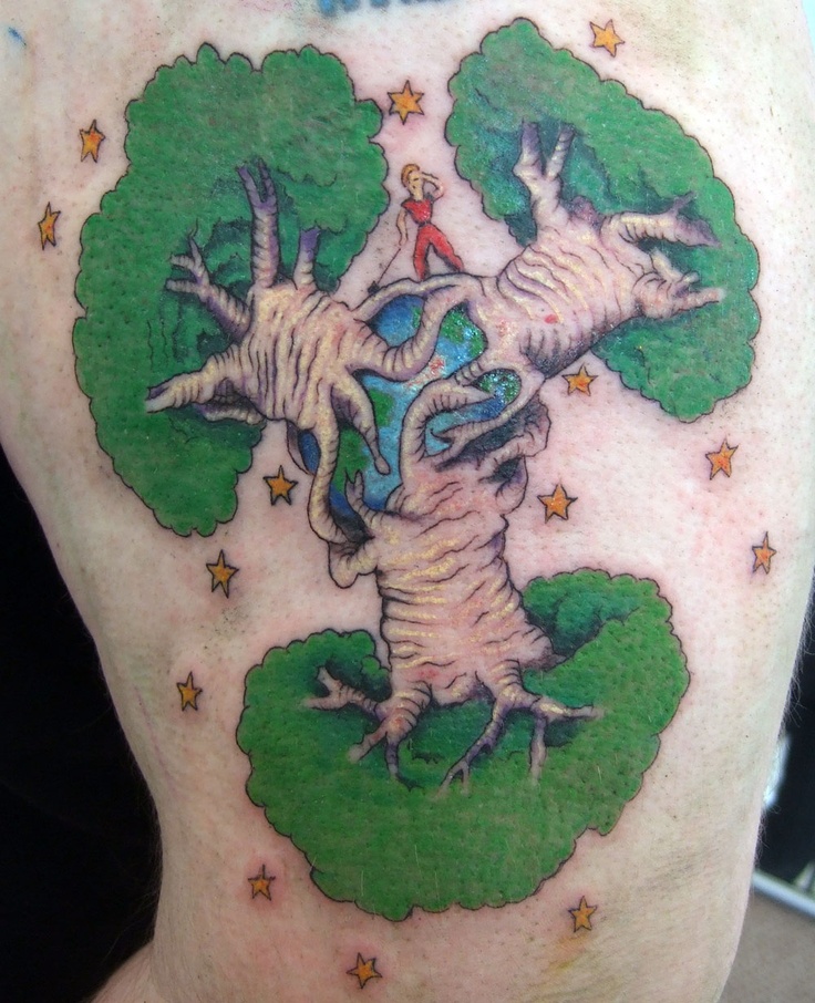 a man's back with a tree and stars tattoo on his shoulder, which has the image of two hands reaching out to each other hand