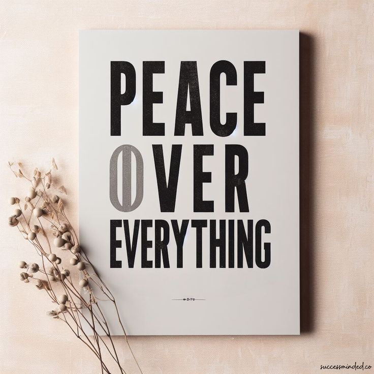 a poster with the words peace over everything on it next to some dried plant stems